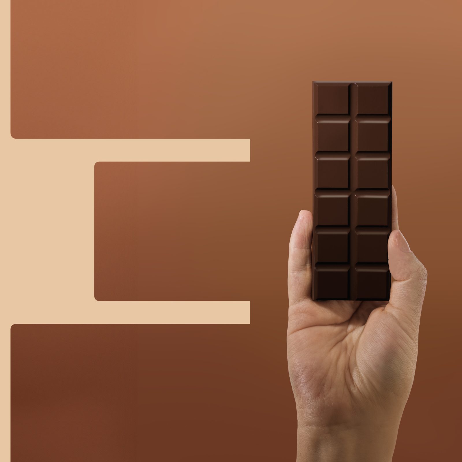 Hand holding a chocolate bar inside a letter E